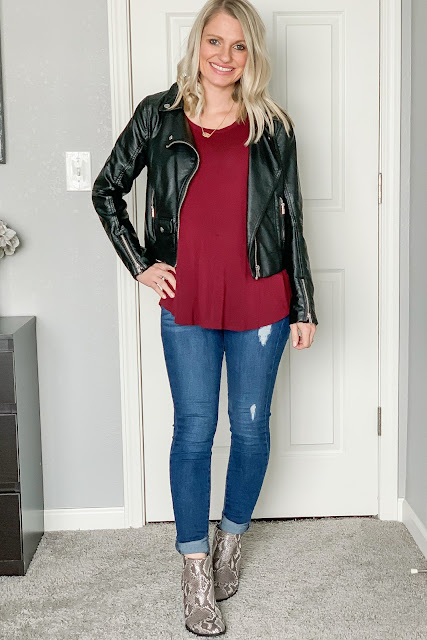 Date night outfit with a moto jacket and snakeskin booties