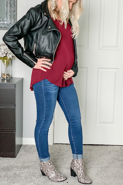 Date night outfit with a moto jacket and snakeskin booties