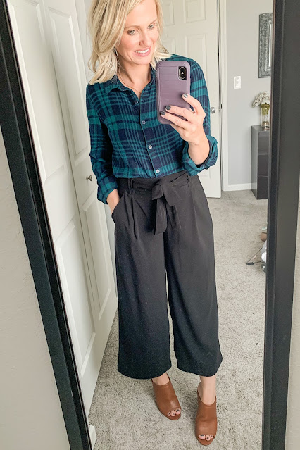 Thanksgiving outfit idea with plaid flannel shirt and paper bag pants