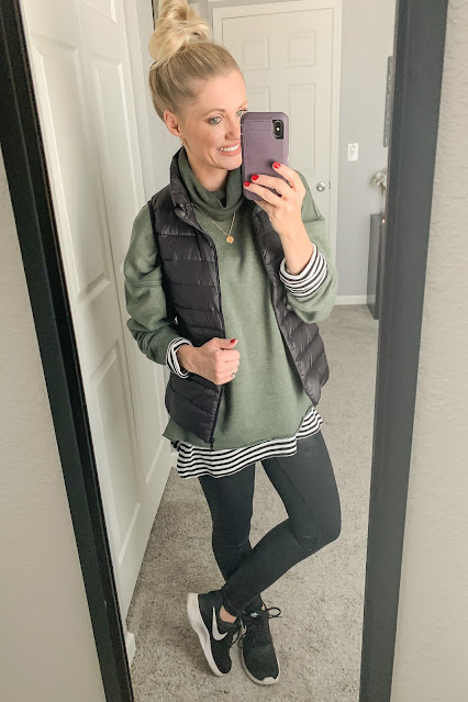 Turtleneck sweatshirt layered with a vest