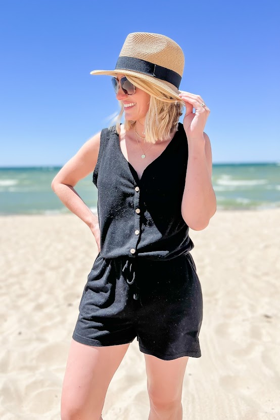 Black romper with straw hat
