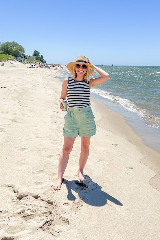tank and linen shorts with a straw hat