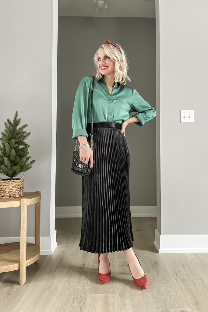 Satin green shirt with pleated skirt.