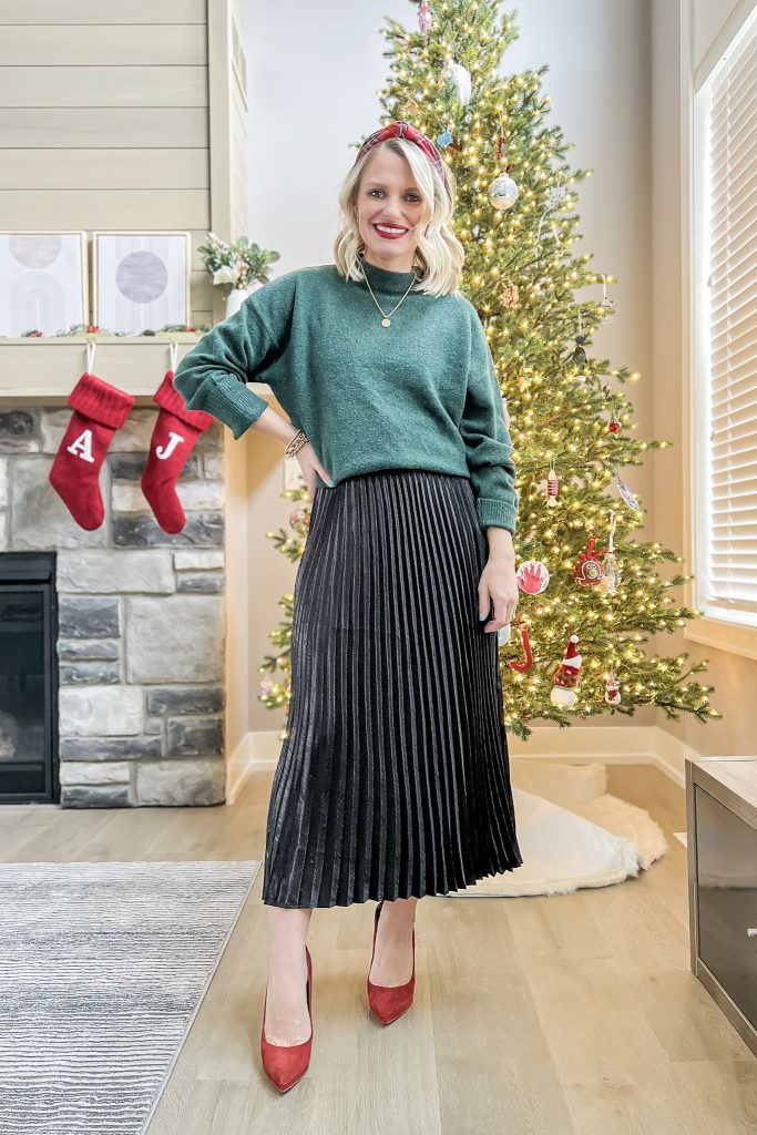 Green sweater with a pleated skirt.