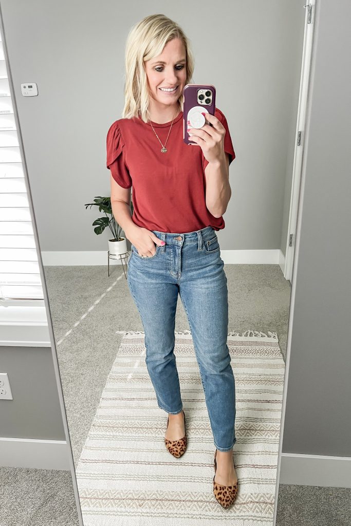 Madewell petite jeans with a rust t-shirt.