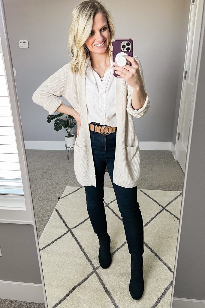 White button down shirt with tan cardigan.
