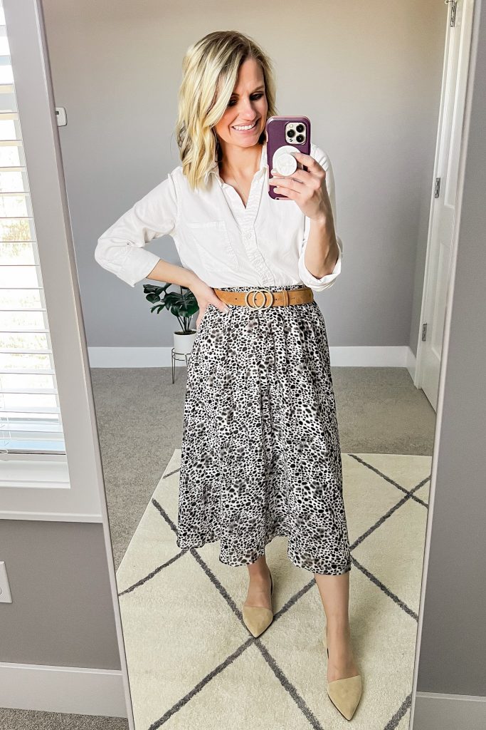 Leopard pleated skirt with a white button-down shirt.