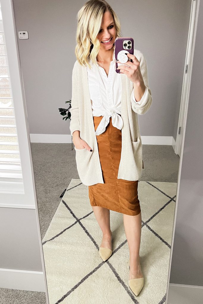 Faux suede skirt and white button down shirt.