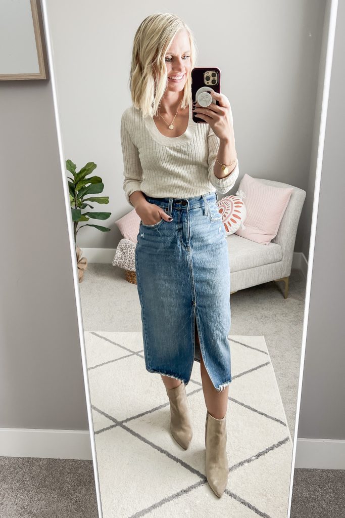 Lightweight sweater with a denim midi skirt and booties.