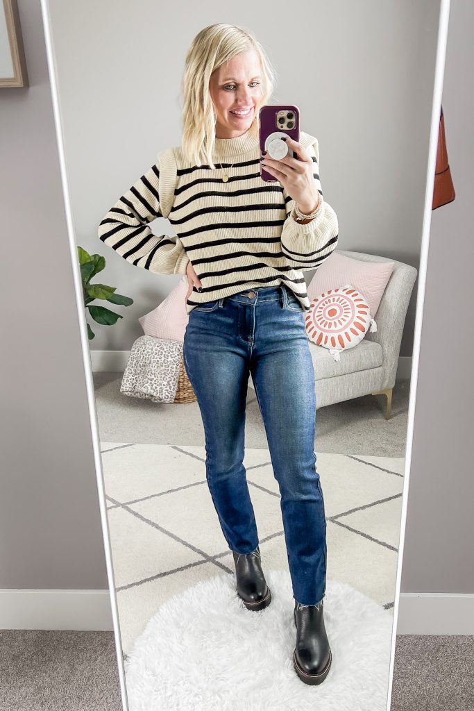 Chelsea boots styled with a longer pair of straight-leg jeans.