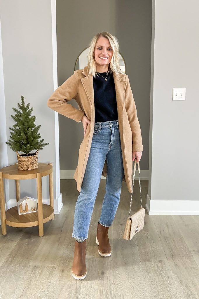 Brown Chelsea boots styled with straight leg jeans.
