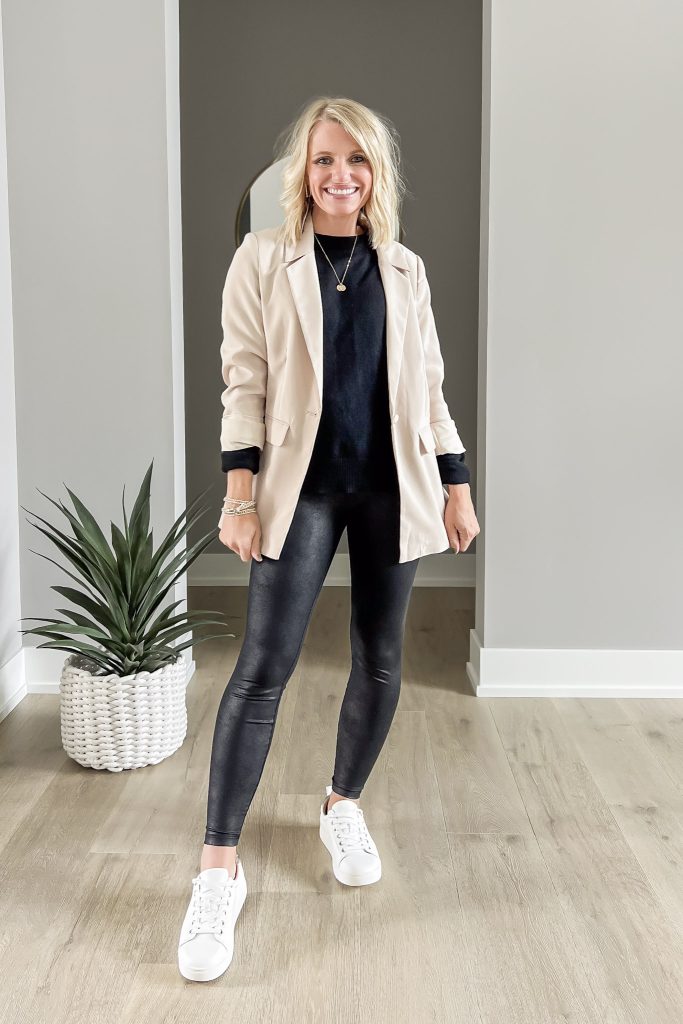 Black sweater with leggings and tan blazer.