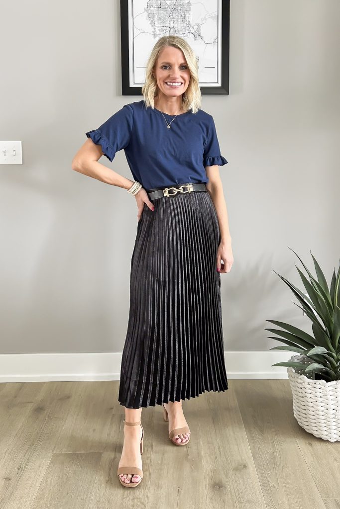 Navy top with a black skirt.