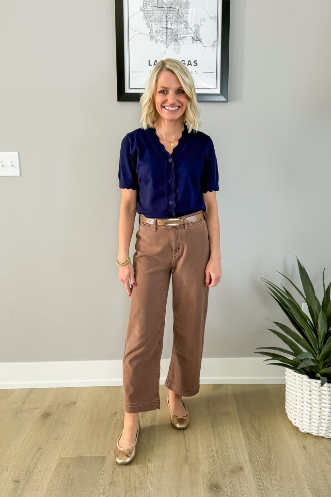 how to style brown pants outfit idea with a scalloped navy cardigan and gold ballet flats